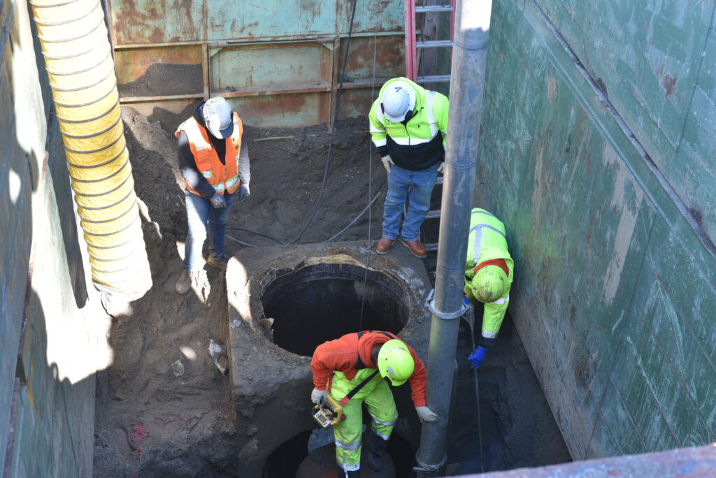 Construction workers assessing damage